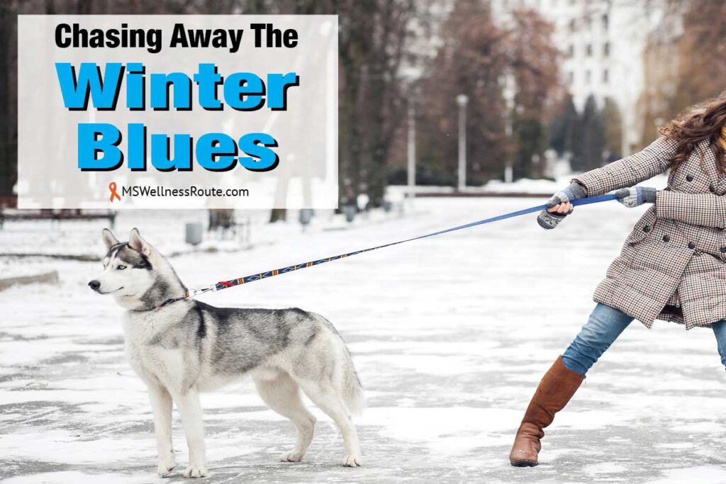 Woman holding back husky in the snow with overlay: Chasing Away The Winter Blues