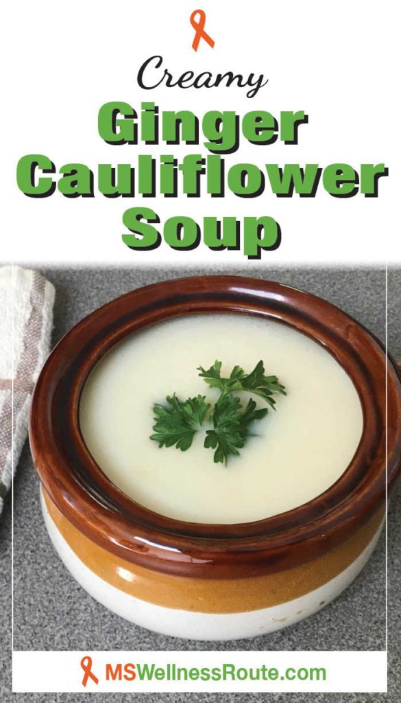 Bowl of cauliflower soup with headline: Creamy Ginger Cauliflower Soup