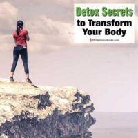 Woman standing rock overlooking valley with overlay: Detox Secrets to Transform Your Body