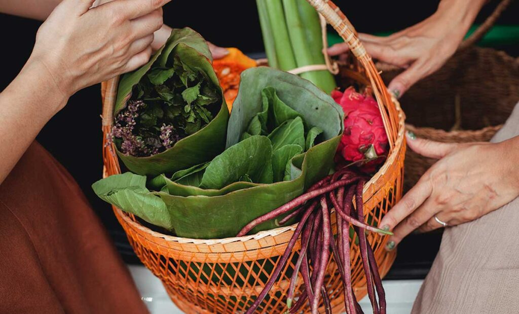 Close Up Photo of Fruits and Vegetables in a Wicker Basket