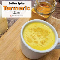 Cup of turmeric milk on cutting board with overlay: Golden Spice Turmeric Latte