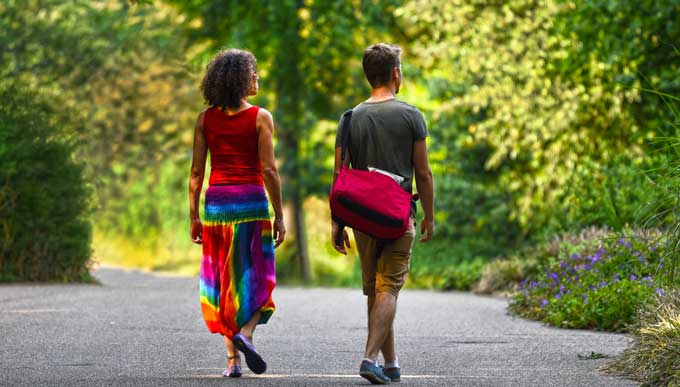 Woman and man walking outside.