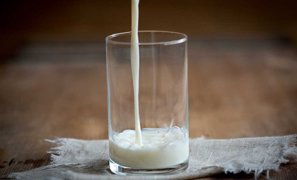 Milk pouring into a glass.