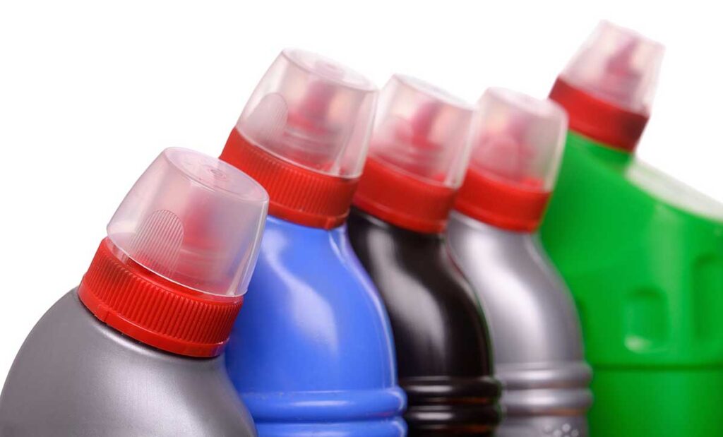 Tops of plastic bottles with lids containing solvents.