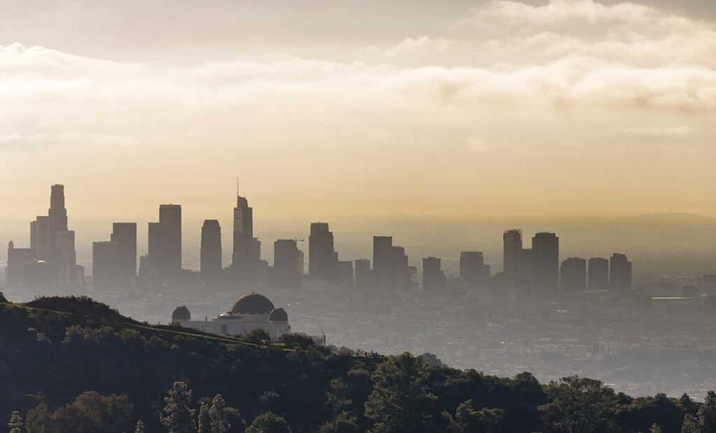 Sunset with skyscrapers and haze.