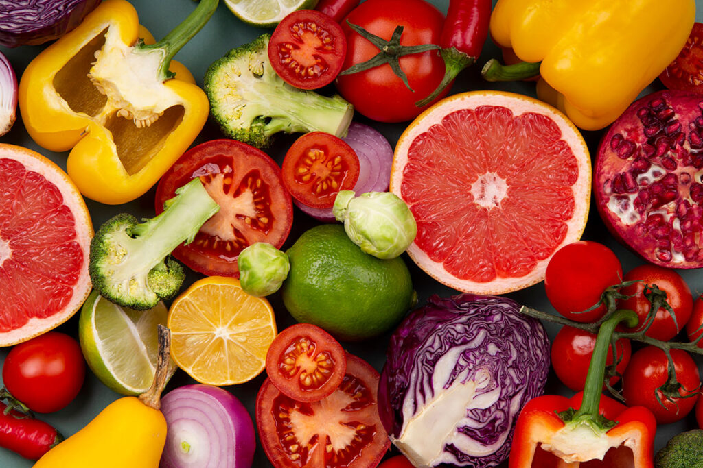 Looking down at an arrangement of mixed fruits and vegetables. 